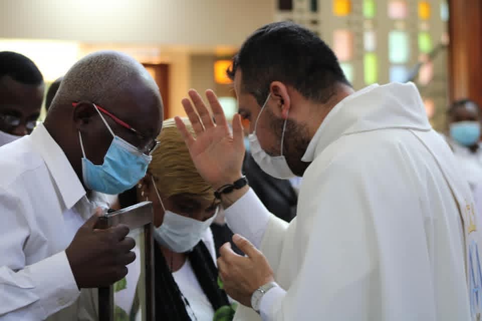 Father Ignacio, MG, blessing Christians